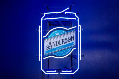 A neon beer can sign with the name Anderson on the front