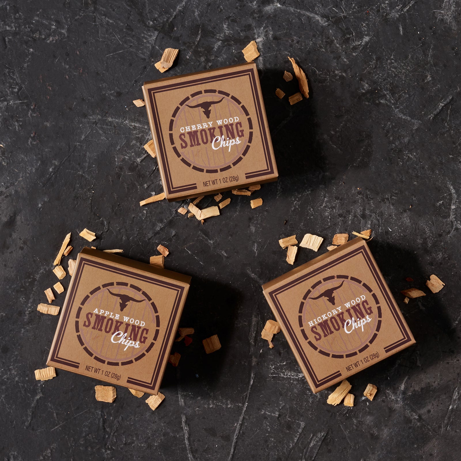 Three varieties of wood smoking chips, in cherry wood, apple wood and hickory wood