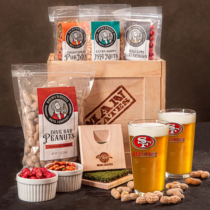 A San Francisco 49ers football fan crate with personalized beer glasses and various peanut snacks